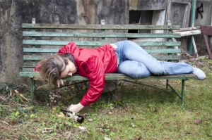 drunk woman sleeping on the bench